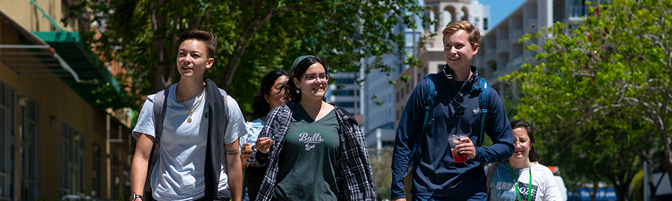A group of students walking on campus.