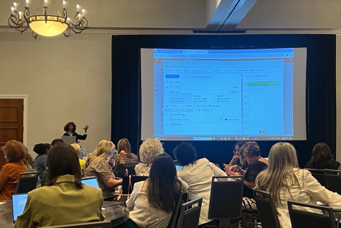 Presenter Dana Holmes-Jenkins presents to the large group of people